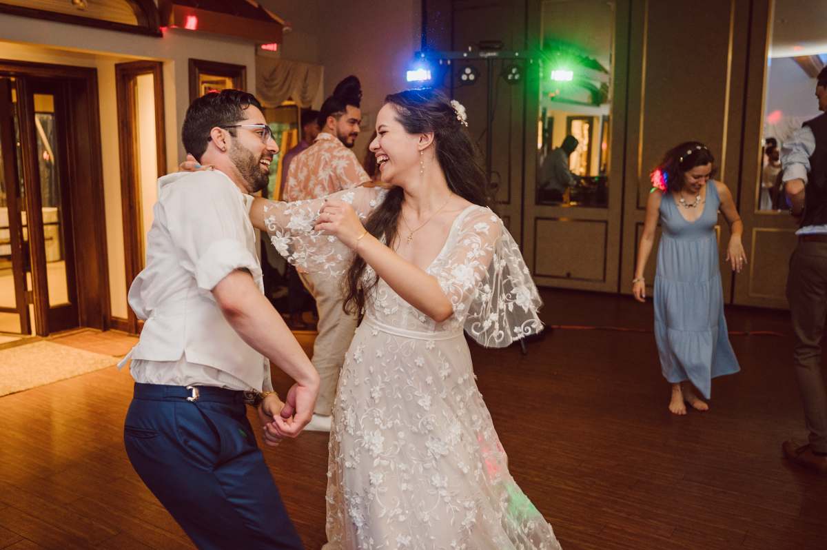 These two dancers, passionate lovers got married on a hot humid day at Auletto Caterers in Deptford NJ. Even though it was hot & humid Nina and Hector were all smiles as well as their family during the family portrait time. Wedding couple's and families that listens to you and does everything you ask them to even though the weather and environment can be tough are the BEST kind of clients! Nina and Hector were that best ideal clients, they from day one left all control regarding photo to me, did not question or have concerns. Knowing that you have this full trust and control on the wedding day makes you want to give your 100% and more. Nina and Hector are one of my top ideal clients and their wedding day photos are living proof of it. Nina and Hector's wedding day was combined of casual, mess, chaos, laughters, chill, emotional and passionate love for dancing. This was my first time at Auletto Caterers and in this part of NJ and this wedding venue in Deptford NJ was a pleasant surprise. It was full of secret locations for photos, garden, little pond where I played around with reflections, peacocks, waterfall and lavender field! Plus kind people to work with. Nina and Hector's July wedding at Auletto Caterers NJ captured by Karis from Hey Karis NY, NJ, Brooklyn, Hudson Valley and Catskills Wedding and Elopement Photographer.